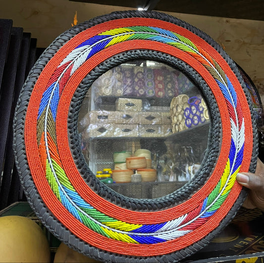 Mirror with beaded frame